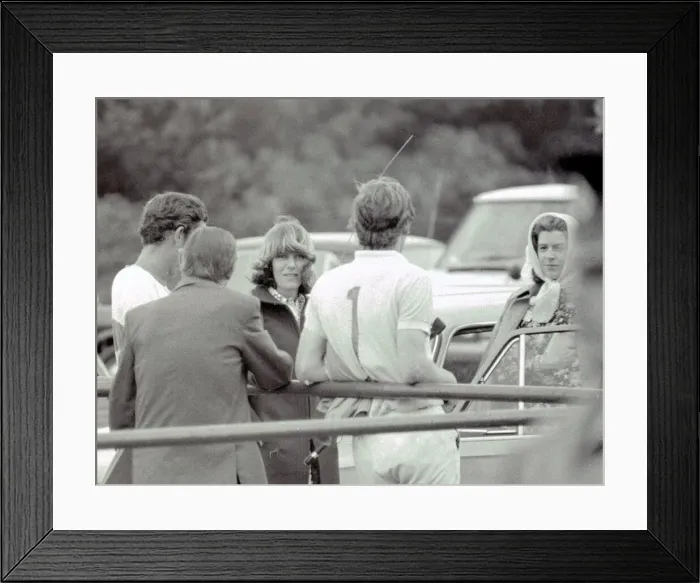 Framed Print : Prince Charles leans back on to railings as he chats with Camilla Parker Bowles during a Framed Print : Prince Charles leans back on to railings as he chats with Camilla Parker Bowles during a