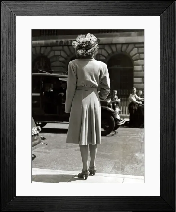Framed Print : Fashion 1940s Model with her back to the camera wearing a pleated coat with doleen sleves Framed Print : Fashion 1940s Model with her back to the camera wearing a pleated coat with doleen sleves