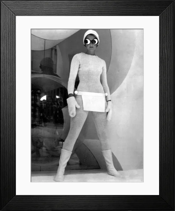 Framed Print : Model wearing knitted all in one suit with joke goggles and woolly hat