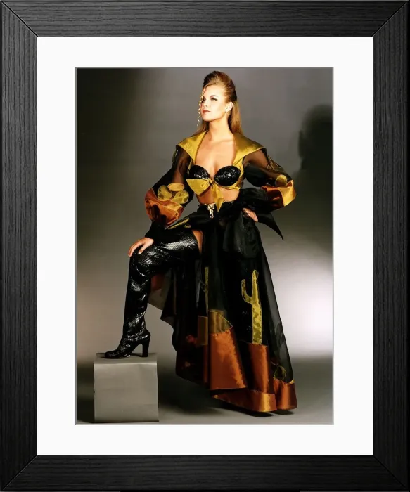 Framed Print : Clothing fashion Female model wearing black knee high boots and a black yellow Framed Print : Clothing fashion Female model wearing black knee high boots and a black yellow