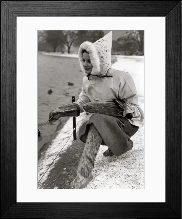 Framed Print : A woman dressed in a strange outfit including matching boots