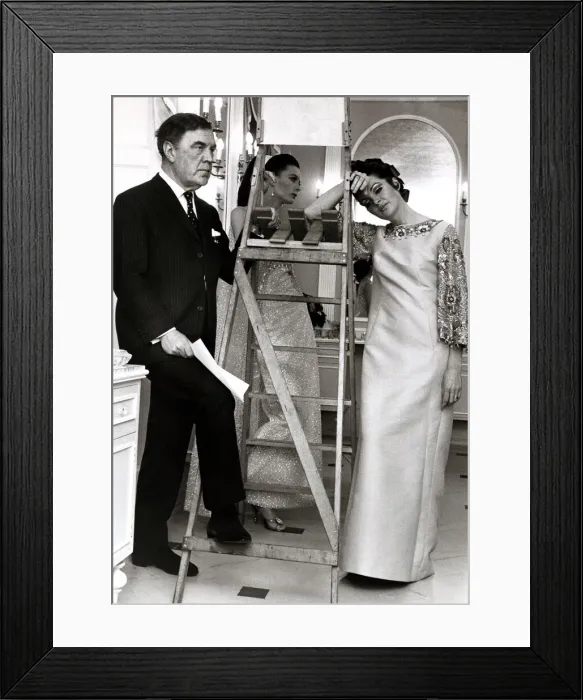 Framed Print : Norman Hatnell, Fashion Designer looking frustrated in his unfinished new hairdressing