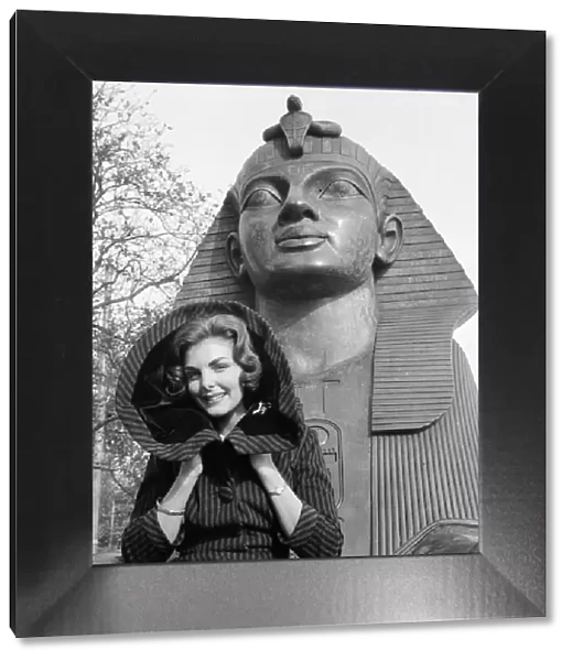 1959 Miss World Contestant poses in front of the Sphynx on the Embankment of the River