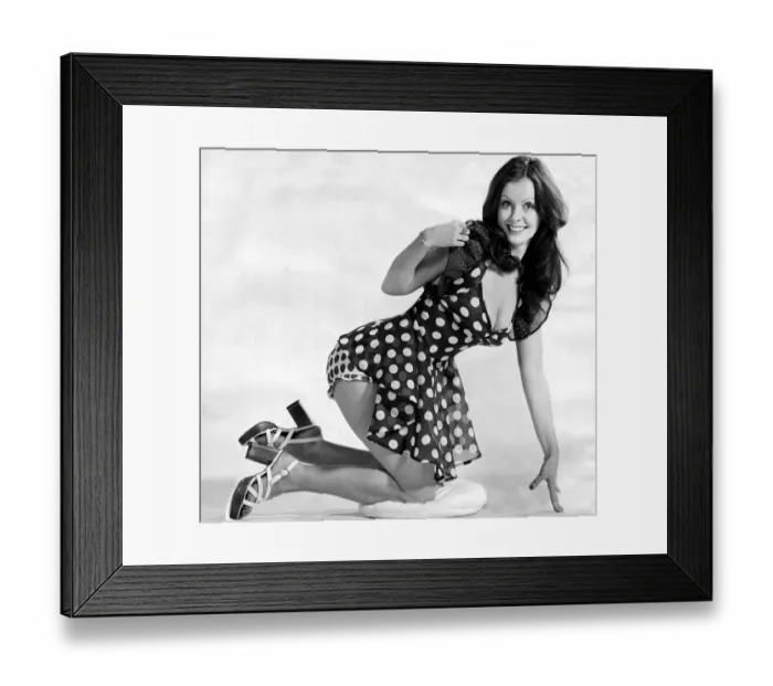 Framed Print : Model wearing a polka-dot summery short dress with high heels June 1973