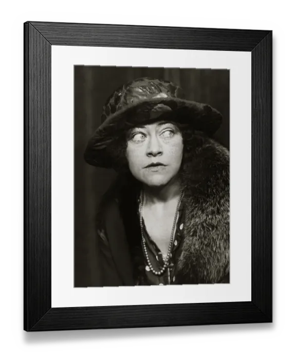 Framed Print : A woman wearing 1920s style clothing including coat, big hat and necklace Framed Print : A woman wearing 1920s style clothing including coat, big hat and necklace
