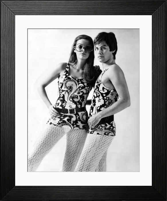 Framed Print : His and hers outfits of flowery tank tops and open knit stockings January 1970
