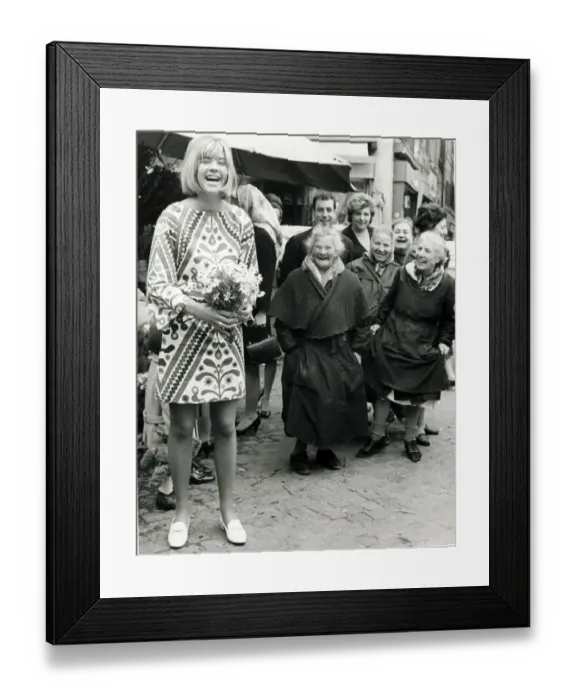 Framed Print : Trisha Locke wearing a short skirt in Rome Italy seen with local flower sellers Framed Print : Trisha Locke wearing a short skirt in Rome Italy seen with local flower sellers