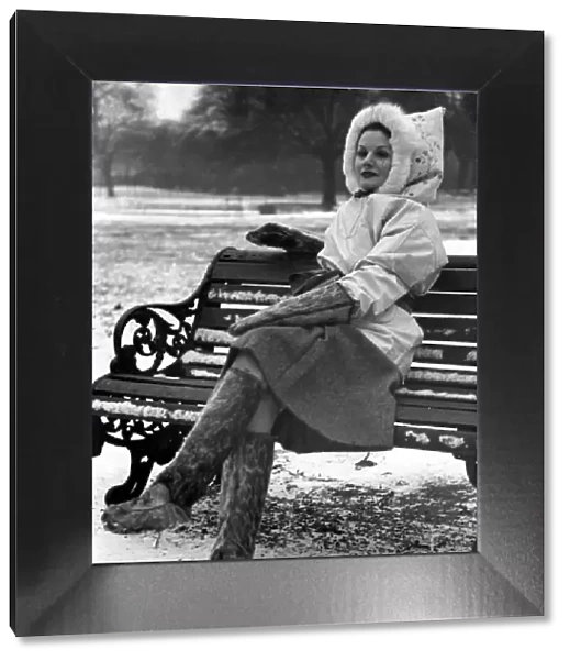 Fashion 1930s Miss Esme Watson sitting on a park bench in Regent