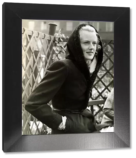 Fashion 1930s Model Waring a black wool coat with hood