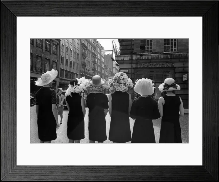 Framed Print : Women modelling hats for the 1966 Royal Ascot festiva - back view of the floral hatsl