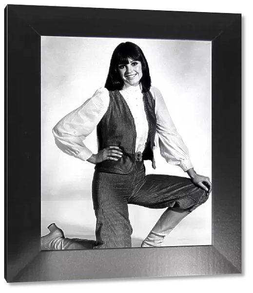 October 1970 Model kneeling on the floor wearing a pale blue cord velvet