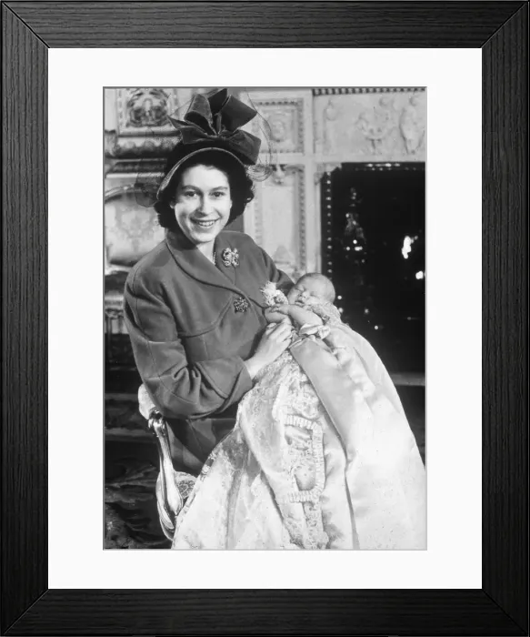 Framed Print : Princess Elizabeth holds her baby son Prince Charles in the drawing room at Buckingham