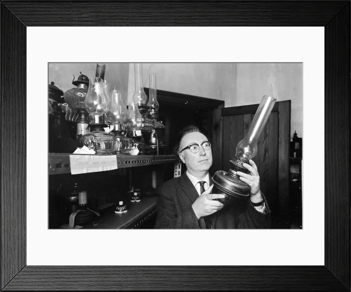 Framed Print : Bowes Museum Jan 1970 Director Frank Atkinson studies some of the antque items Framed Print : Bowes Museum Jan 1970 Director Frank Atkinson studies some of the antque items