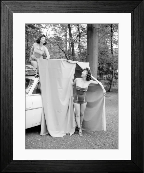 Framed Print : Two reveille models seen here demonstrating the new car rack tent Framed Print : Two reveille models seen here demonstrating the new car rack tent