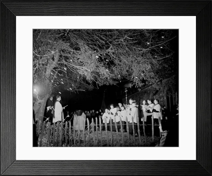 Framed Print : The vicar of Martins Church in Herne conducts a carol service under a christmas tree in Framed Print : The vicar of Martins Church in Herne conducts a carol service under a christmas tree in