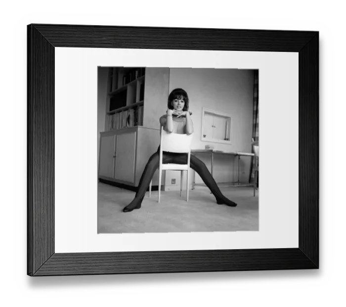 Framed Print : Jackie Collins authoress sitting astride a chair at home Mar 1964 Framed Print : Jackie Collins authoress sitting astride a chair at home Mar 1964