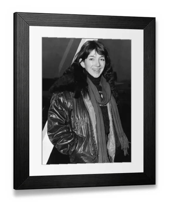 Framed Print : Pop singer Kate Busharriving at London Airport wearing a leather jacket with fur collar Framed Print : Pop singer Kate Busharriving at London Airport wearing a leather jacket with fur collar