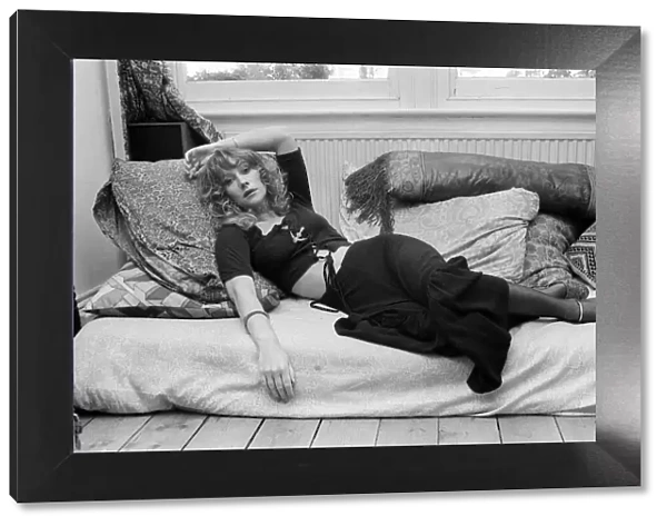 Actress Helen Mirren pictured lying down on her sofa at her Fulham home September