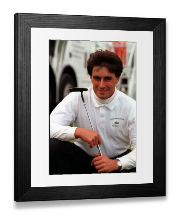 Framed Print : Jean Van De Velde holding iron in both hands kneeling down white polo neck shirt black