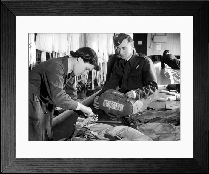 Framed Print : An Officer Observer fetches his Mae West and parachute for checking by a WaFS officer Framed Print : An Officer Observer fetches his Mae West and parachute for checking by a WaFS officer