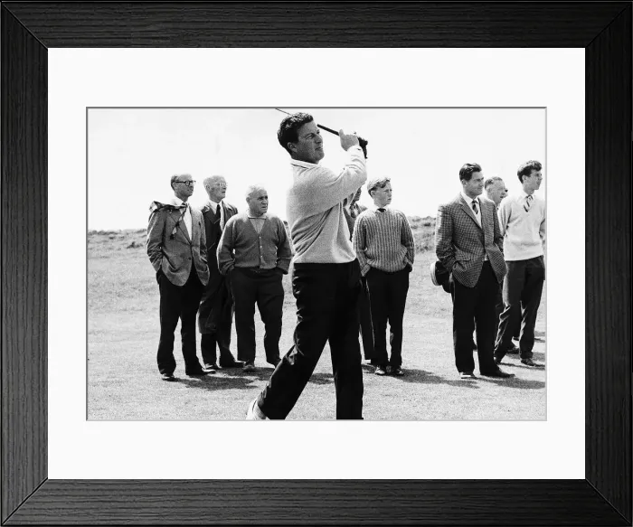 Framed Print : Golfer Peter Thomson playing from the fairway to the 13th hole in front of small group of Framed Print : Golfer Peter Thomson playing from the fairway to the 13th hole in front of small group of