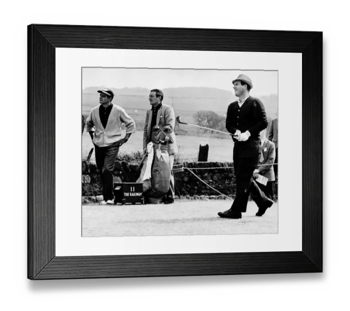 Framed Print : Kel Nagle watches his shot as does Spaniard Sebastian Miguel at the British Golf Open