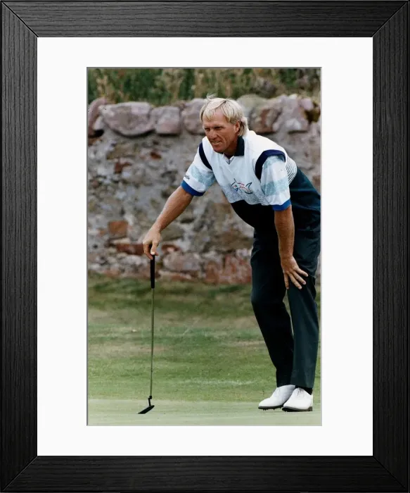 Framed Print : Greg Norman golfer lining up a put