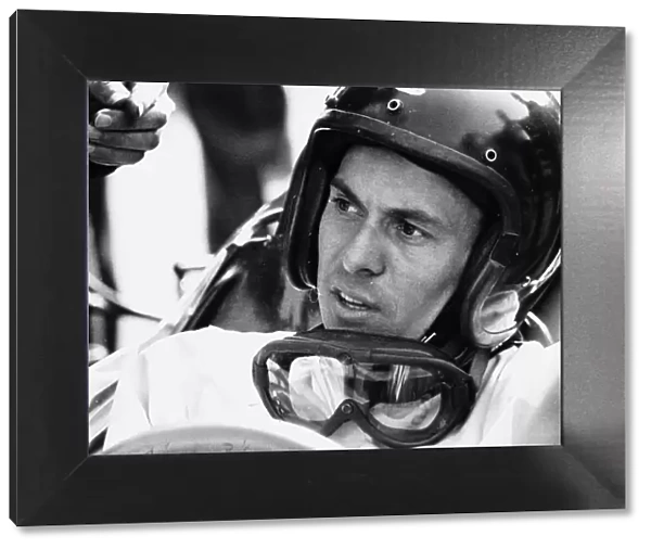 World champion racing driver Jim Clark wearing his helmet