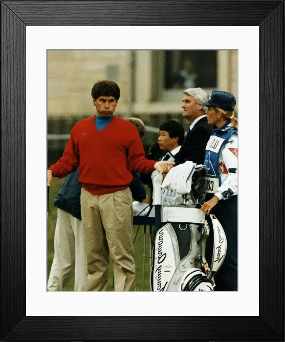 Framed Print : Fred Couples gesturing to wife Barbara who is his caddie fans in background golf Framed Print : Fred Couples gesturing to wife Barbara who is his caddie fans in background golf