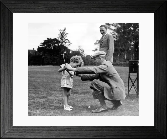 Framed Print : Boys Golf Championship John Havers, aged 4, being taught the game by his uncle Framed Print : Boys Golf Championship John Havers, aged 4, being taught the game by his uncle