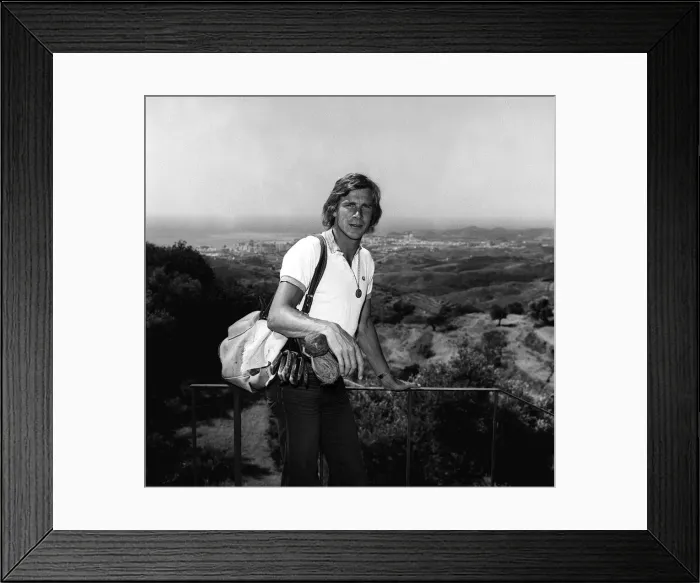 Framed Print : Motor racing driver James hunt on holiday in Spain 1975 with his golf clubs