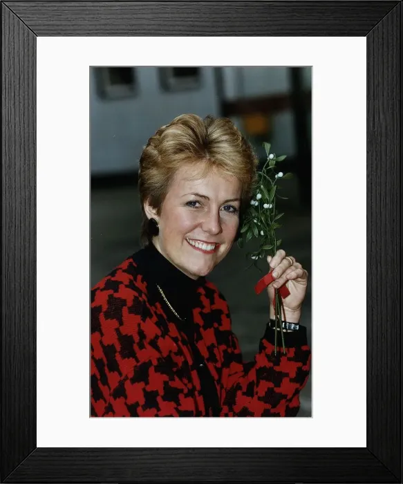 Framed Print : Jill Dando TV Presenter holding mistletoe Framed Print : Jill Dando TV Presenter holding mistletoe