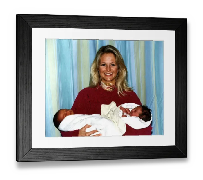 Framed Print : Ulrika Jonsson TV Presenter holding 2 babies Shaquelle Didson and Eleanor Louise Albury