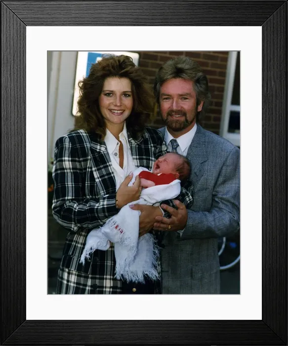 Framed Print : Noel Edmonds TV Presenter with his wife and baby