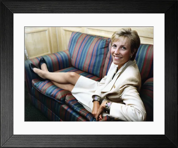 Framed Print : Jill Dando TV Presenter sitting with legs up on sofa