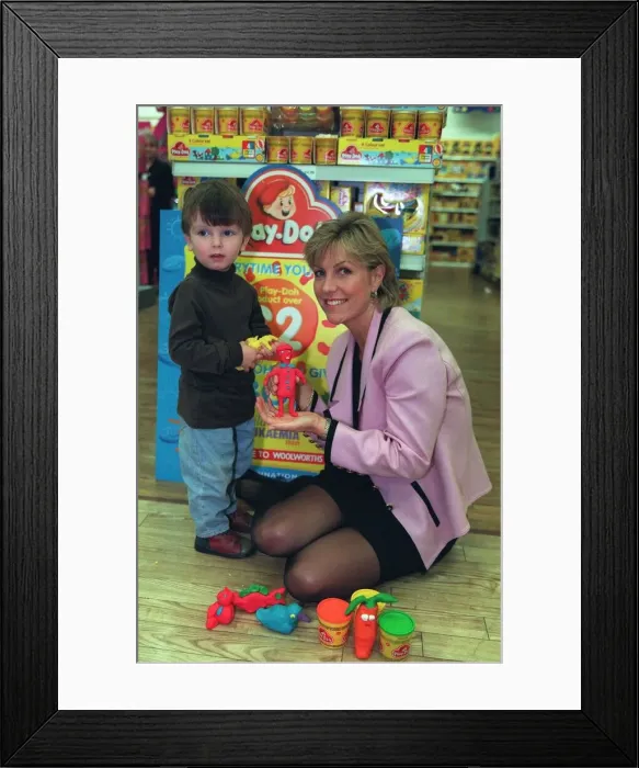 Framed Print : Tv Presenter Jill Dando and Oliver play with some Play Doh in Woolworths A© Framed Print : Tv Presenter Jill Dando and Oliver play with some Play Doh in Woolworths A©