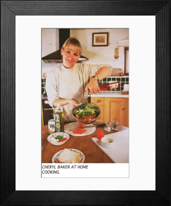 Framed Print : Cheryl Baker TV Presenter busy cooking in the kitchen of her house Framed Print : Cheryl Baker TV Presenter busy cooking in the kitchen of her house