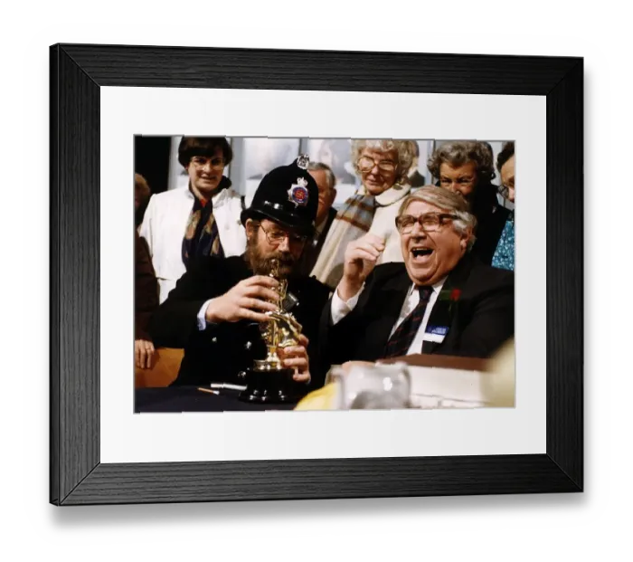 Framed Print : Noel Edmonds TV Presenter Game Show Host in disguise as a policeman handing out an award Framed Print : Noel Edmonds TV Presenter Game Show Host in disguise as a policeman handing out an award