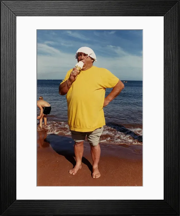 Framed Print : Les Dawson Comedian on Beach eating Ice-Cream A©mirrorpix