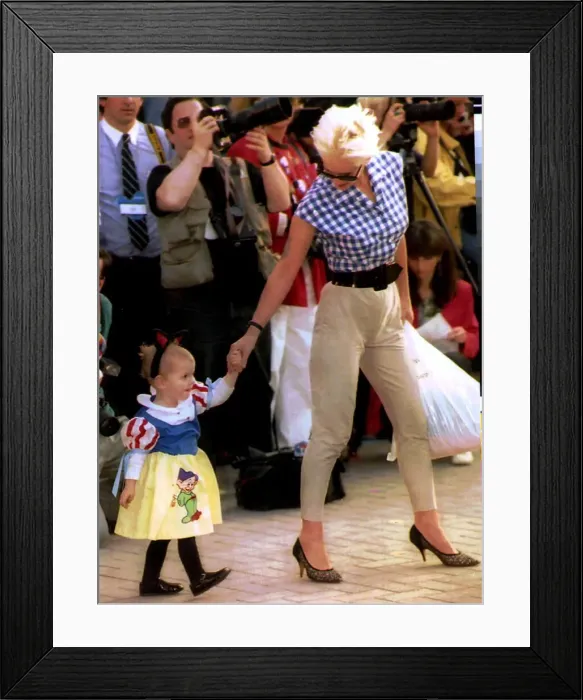 Framed Print : Paula Yates TV Presenter and Model with daughter at Eurodisney Framed Print : Paula Yates TV Presenter and Model with daughter at Eurodisney