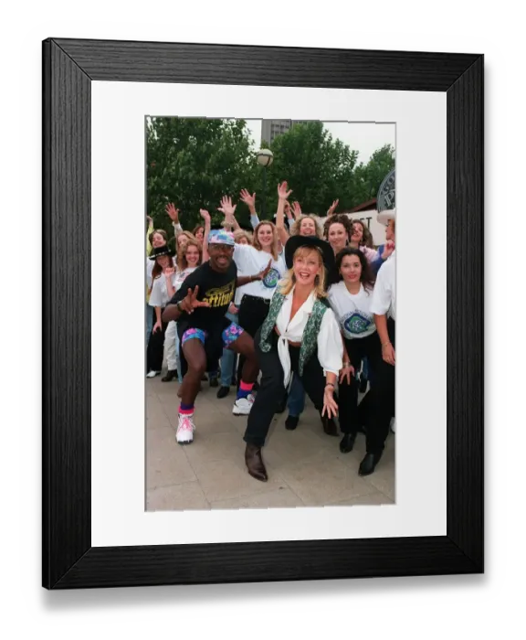 Framed Print : Mr Motivator TV Presenter with Sally Meen GMTV Presenter wearing hat during an outside