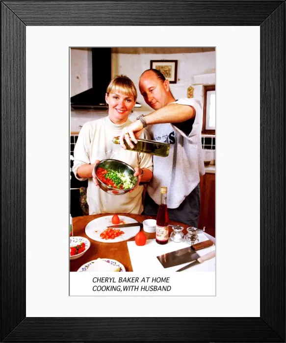 Framed Print : Cheryl Baker TV Presenter busy cooking in the kitchen of her house with her husband Steve
