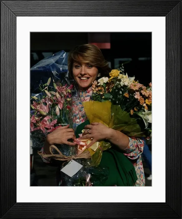 Framed Print : Anne Diamond TV Presenter Holding flowers