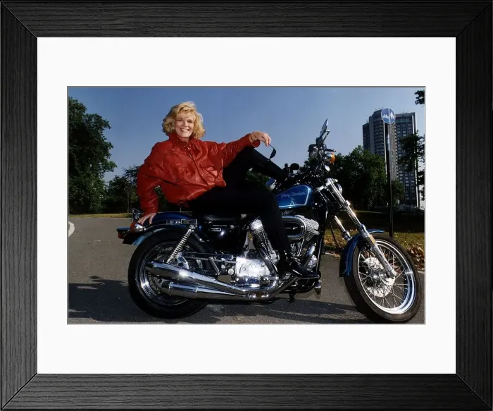 Framed Print : Alison Holloway TV Presenter sitting on her Harley Davidson in Hyde Park Framed Print : Alison Holloway TV Presenter sitting on her Harley Davidson in Hyde Park