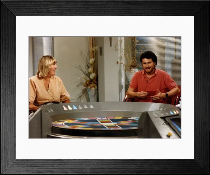 Framed Print : Rory McGrath tv presenter of Trivial Pursuits with Hilary Bonner a contestant Framed Print : Rory McGrath tv presenter of Trivial Pursuits with Hilary Bonner a contestant