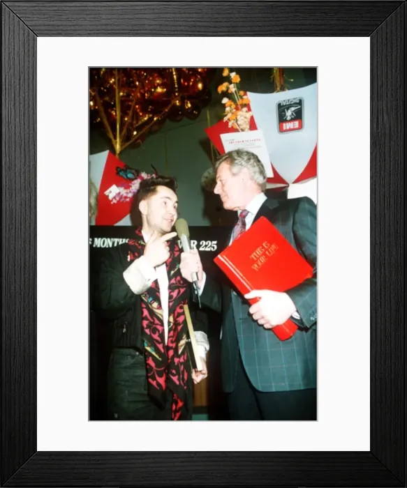 Framed Print : Michael Aspel TV Presenter of This is your Life surprising Nigel Kennedy holding red book Framed Print : Michael Aspel TV Presenter of This is your Life surprising Nigel Kennedy holding red book