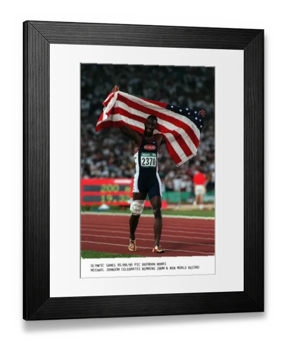 Framed Print : Michael Johnson American athlete celebrates winning the 200m final