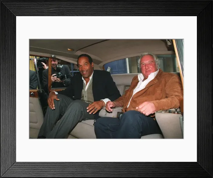 Framed Print : Michael Winner Actor and OJ Simpson in the back of a car Framed Print : Michael Winner Actor and OJ Simpson in the back of a car