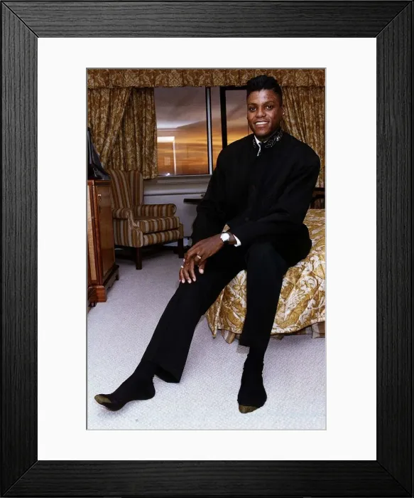 Framed Print : Carl Lewis Athletics and sports commentator sitting on edge of bed in hotel room Framed Print : Carl Lewis Athletics and sports commentator sitting on edge of bed in hotel room