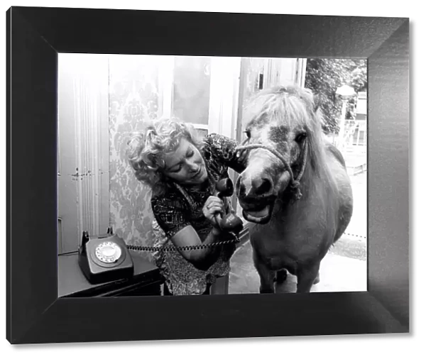 Dally the Shetland Pony and her owner Olga Denver stand in the hallway of her home as